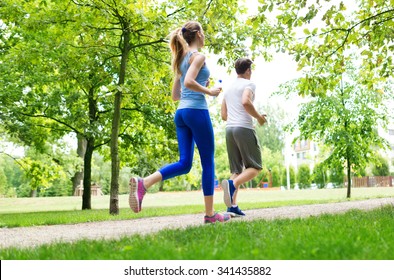 Couple Jogging In The Park
