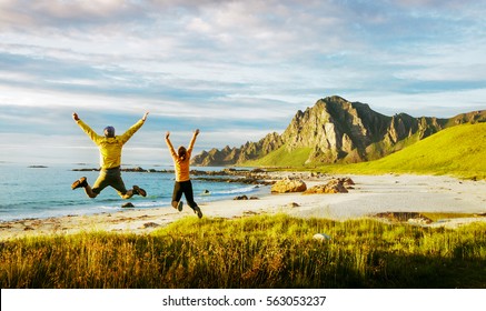 couple jumping and having fun in Norway - Powered by Shutterstock