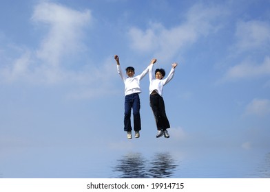Couple jumping with reflection