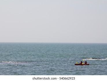 A Couple Kayaking At The Anjuna Beach In Goa, India.