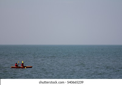 A Couple Kayaking At The Anjuna Beach In Goa, India.