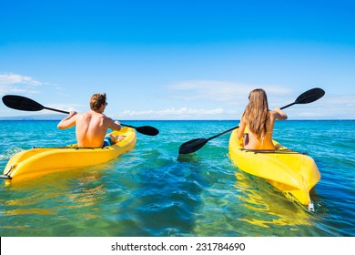 Couple Kayaking in the Ocean on Vacation 