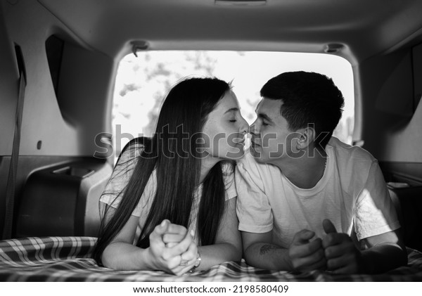 couple kissing in car\
travel