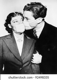 Couple Kissing Each Other With Health Masks