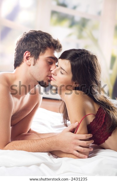 Couple Kissing Hugging On Bed Bedroom Stock Photo Edit Now