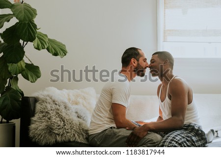 Couple kissing on the sofa