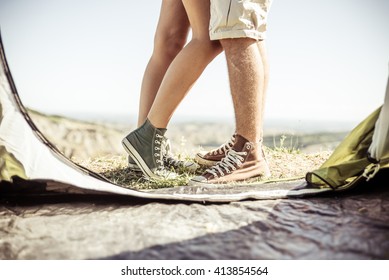 Couple Kissing Out Their Tent. Couple On A Camping Excursion On The Hills