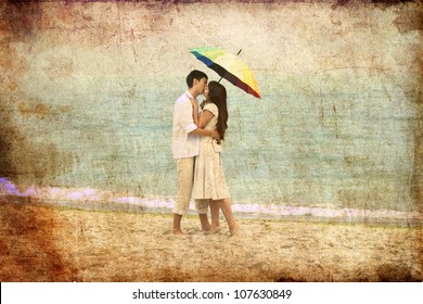 Couple Kissing Under Umbrella At The Beach. Photo In Old Image Style.
