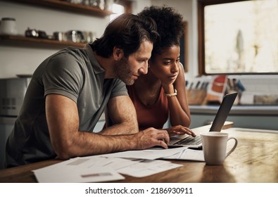 Couple With A Laptop Doing Finance Paper Work, Paying Debt Insurance Loans Or Online Ebanking Together At Home. Two Serious People Planning And Looking At Financial Document, Bills Rate For Mortgage