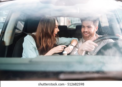 Couple laughs in car. so cool couple - Powered by Shutterstock