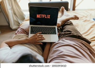 Couple laying in bed and watching Netflix. Skopje/Macedonia/10/06/2020