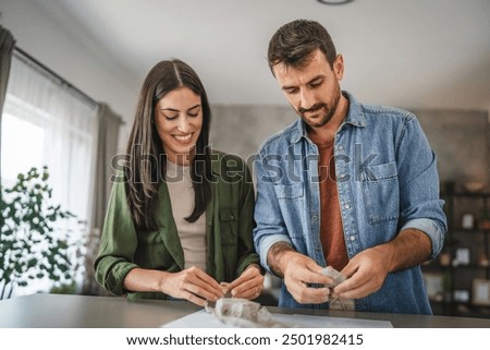 Couple learn and practice how to make a clay figurine, pottery