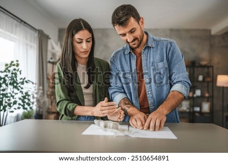 Couple learn and practice how to make a clay figurine, pottery