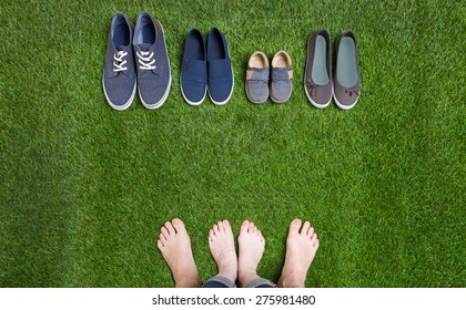 Couple legs and shoes standing  on grass