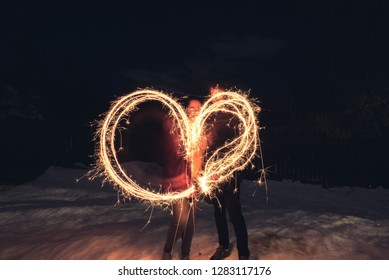 Couple Light Painting A Heart