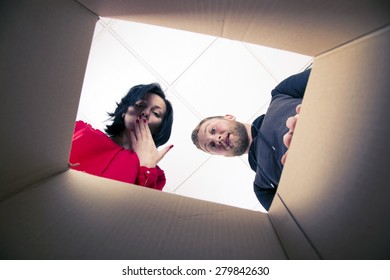 Couple Looking Inside The Box