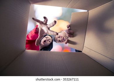 Couple Looking Inside The Box