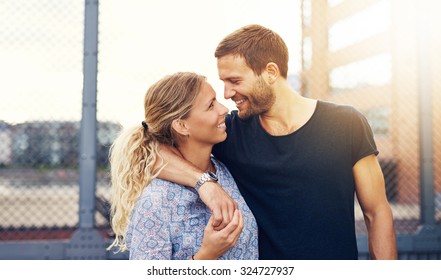 Couple looking into each others eyes while smiling