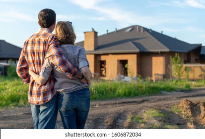 couple looking on new house