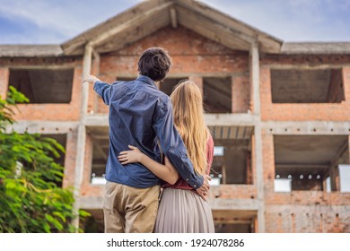 Couple Looking At Their New House Under Construction, Planning Future And Dreaming. Young Family Dreaming About A New Home. Real Estate Concept