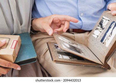 Couple Looking Through Photo Album Together