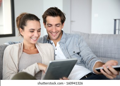 Couple Looking For Tv Program On Internet