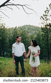 Couple Looks At Each Other While Holding Hands Black Hills