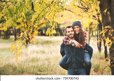Couple In Love In Autumn Leaves