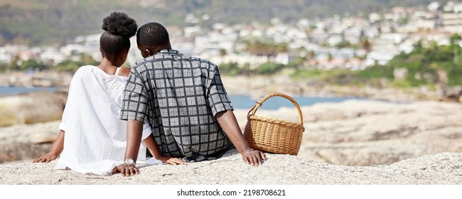 Couple, Love And Beach Picnic For Black Woman Or Man On Summer South Africa Holiday Near Sea, Water Or Ocean City. Safety, Trust Or Security With Zen People And View On Nature Rock On Travel Vacation