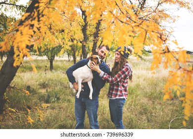 Couple In Love During The Fall With Dog