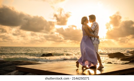 Couple in love embracing each other on the beach, enjoy sunset romantic moment. - Powered by Shutterstock