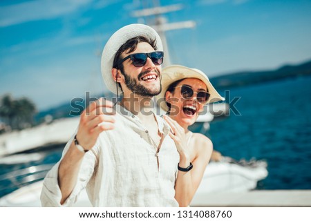 Couple in love, enjoying the summer time by the sea.