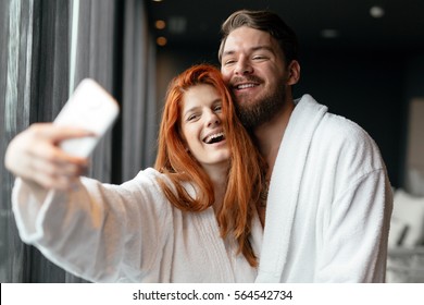 Couple in love enjoying wellness weekend and taking selfies