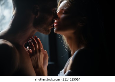 Couple in love face to face, tender hugging and kissing. Beautiful woman and handsome man boyfriend. Couple in love going for the kiss.