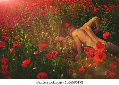 Couple In Love. Flowers Background. Man And Woman Nature. Guy. Nude Couple. Fashion Photo. Model. Summer Time. Beauty Photo. Erotica. Erotic. Passionate Concept. 