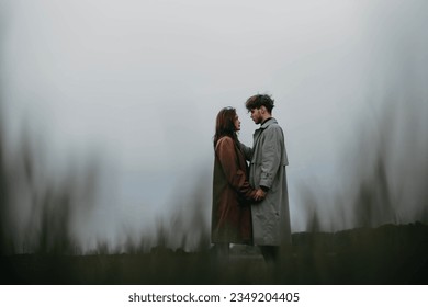 couple in love in a foggy field. Relationship crisis and dramatic love concept - Powered by Shutterstock