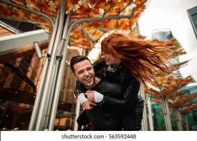 Couple In Love Having Fun In City Street, Crazy Emotions Of Bearded Man And Redhead Woman