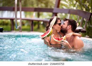 Couple in love hugging and kissing in pool  - Shutterstock ID 2146455753