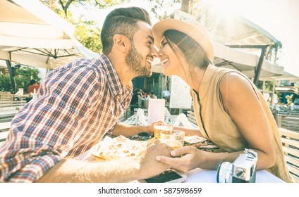 Couple In Love Kissing At Bar Eating Local Delicacie On Travel Excursion - Young Happy Tourists Enjoying Moment At Street Food Restaurant - Relationship Concept With Lovers At First Date - Warm Filter