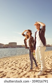 Couple In Love Looking Ahead On The Beach