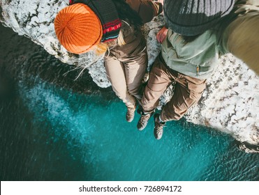 Couple In Love Man And Woman Sitting Together Above Sea On Cliff Travel Happy Emotions Lifestyle Concept. Young Family Traveling Romantic Vacations Autumn Winter Season Aerial View