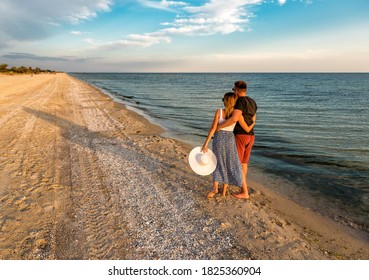 couple in love on the beach at sunset - Powered by Shutterstock