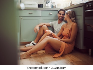 Couple, in love and on kitchen floor looking into their eyes on luxury real estate. Man, woman and communication and a conversation in a new home, house or room before breakfast with family. - Powered by Shutterstock