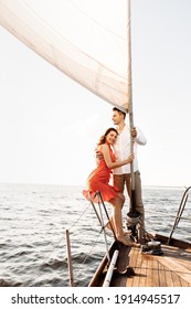 Couple in love on a yacht in the blue sea. High quality photo