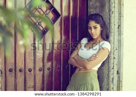 Similar – Woman at the window of a parking garage