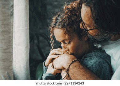 Couple in love with problems. Romantic man and woman hugging each other and kissing in sad life moment. Relationship and caring help people concept image. One mature male care female at home indoor - Powered by Shutterstock