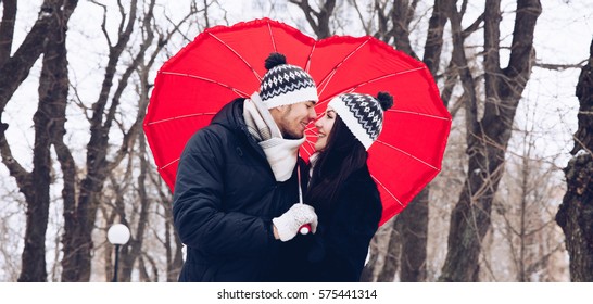 Couple in love with red umbrella - Powered by Shutterstock