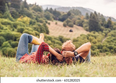 Couple In Love Rest On Green Hill In Country Side