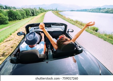 Couple in love ride in cabriolet car