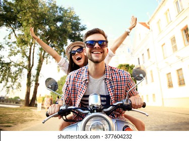Couple In Love Riding A Motorbike , Handsome Guy And Young Sexy Woman Travel . Young Riders  Enjoying Themselves On Trip. Adventure And Vacations Concept.
